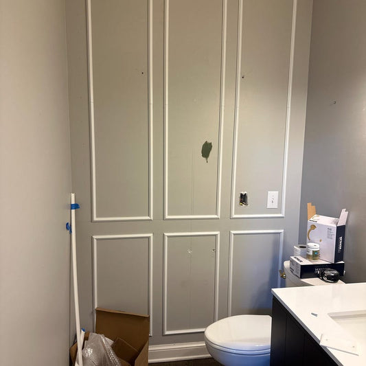 Luxury bathroom interior featuring custom 3-over-3 peel and stick wall molding with a wide center frame, DIY waterproof wall paneling design.