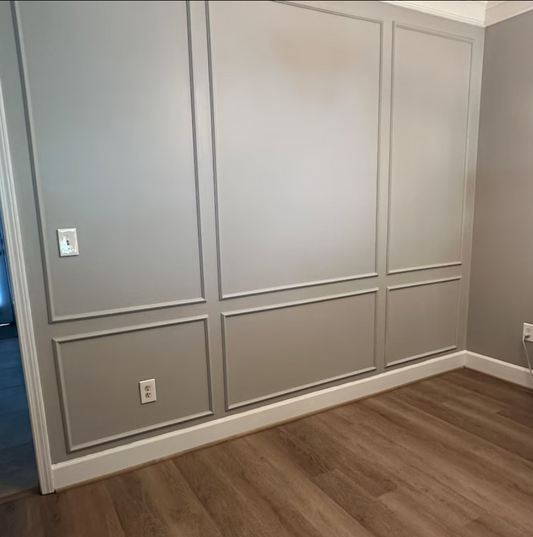 interior featuring custom 3-over-3 peel and stick wall molding with a wide center frame