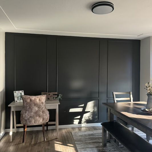 wall molding painted black in a dining room