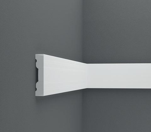 Close-up of primed wall molding pieces ready for assembly