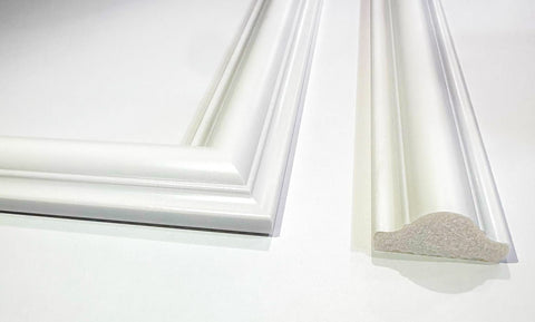 Close-up of wall molding frames showing clean edges and paintable surface